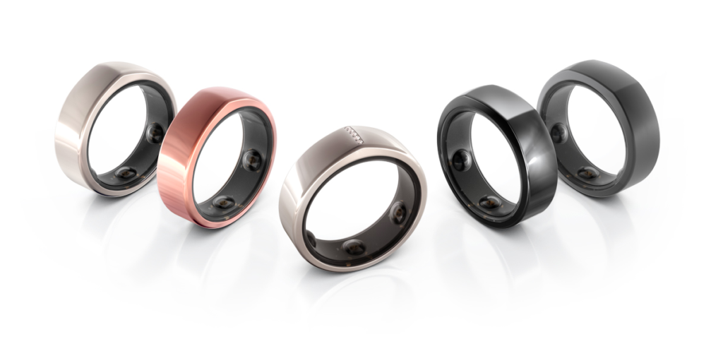 Various Oura smart rings on white background