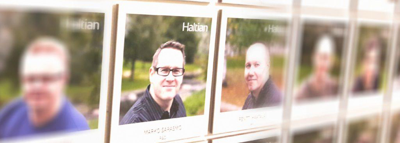 Haltian team member pictures on a wall