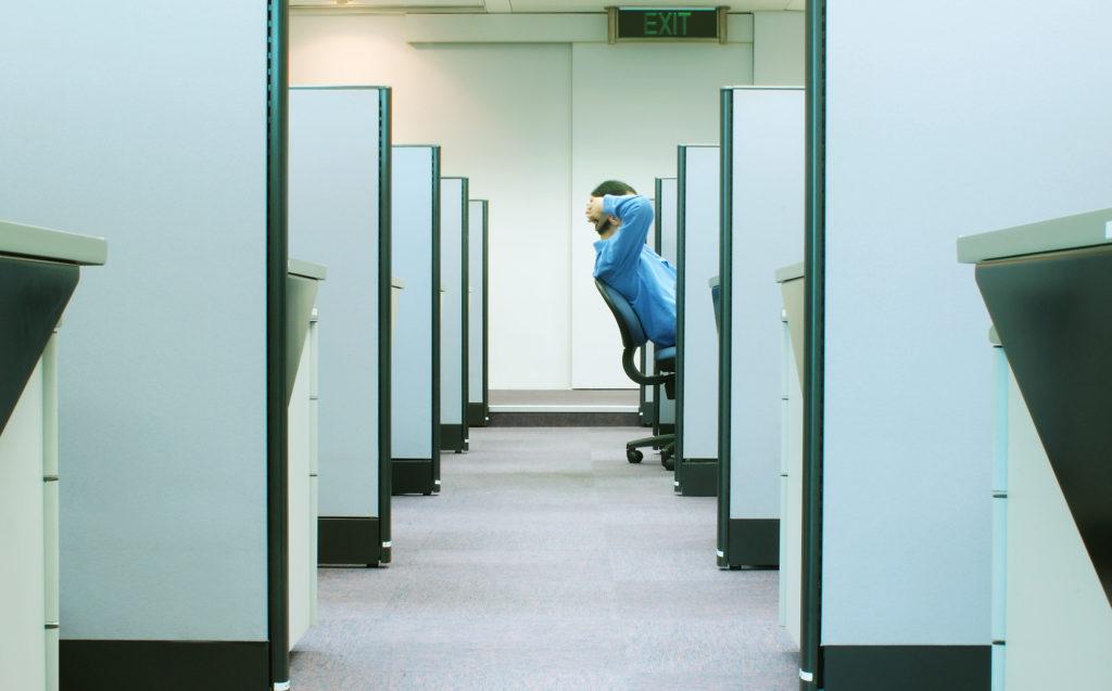 Man sitting in a smart office cubicle