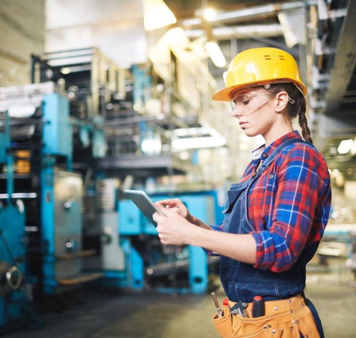 Woman in smart factory, predictive maintenance
