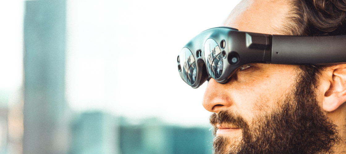 man wearing smart glasses which are one of the product trends