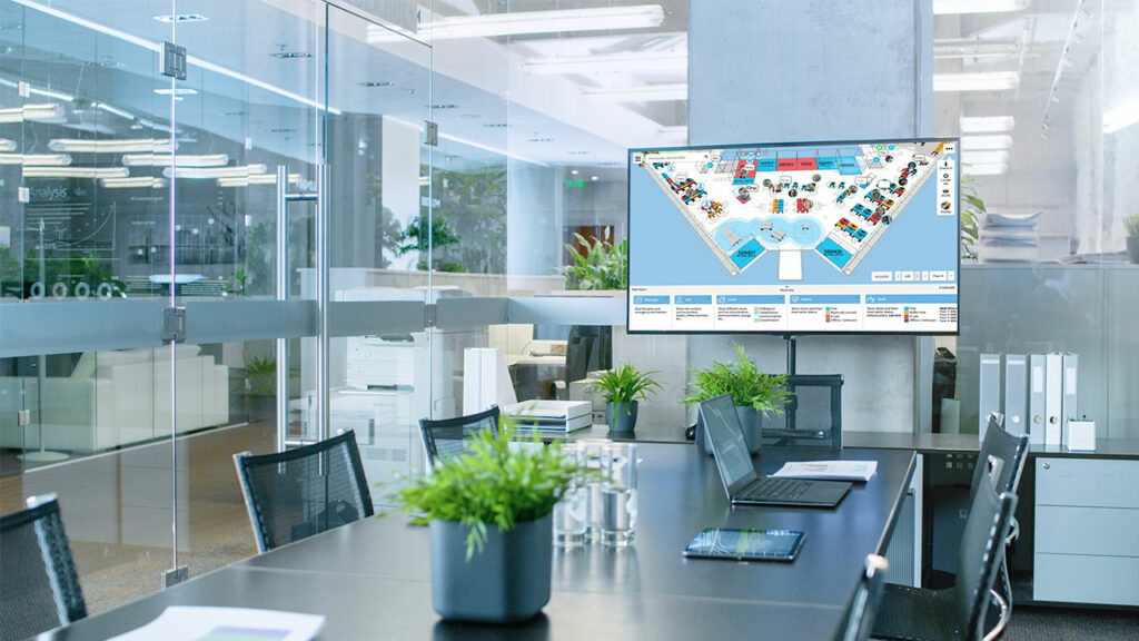 Haltian Empathic Building digital twin on a screen in a meeting room