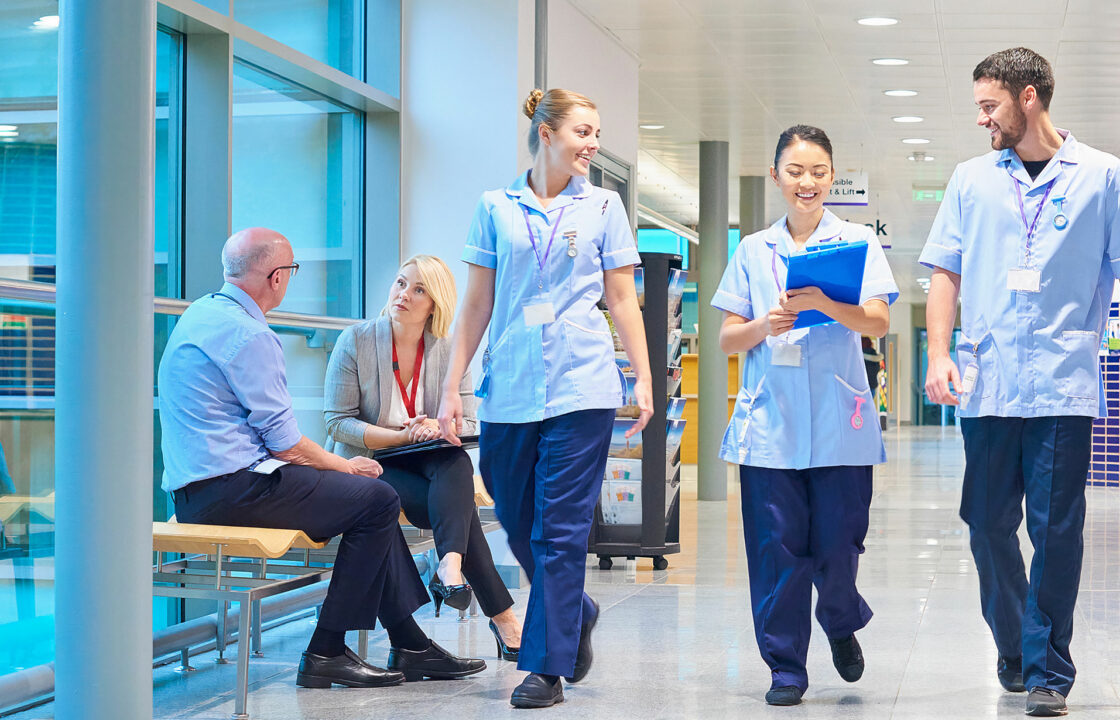 employees walking in a modern, smart hospital