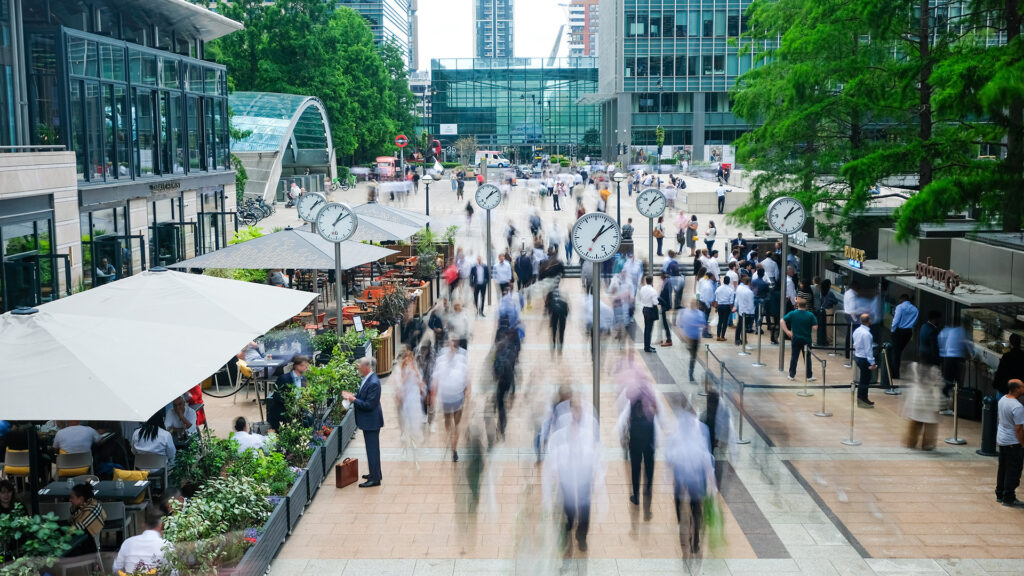 People walking to offices of large corporations and distinctive brands.