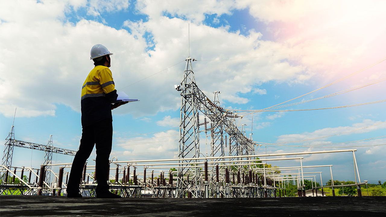 Maintenance person checking electric grids. Sustainability with remote monitoring