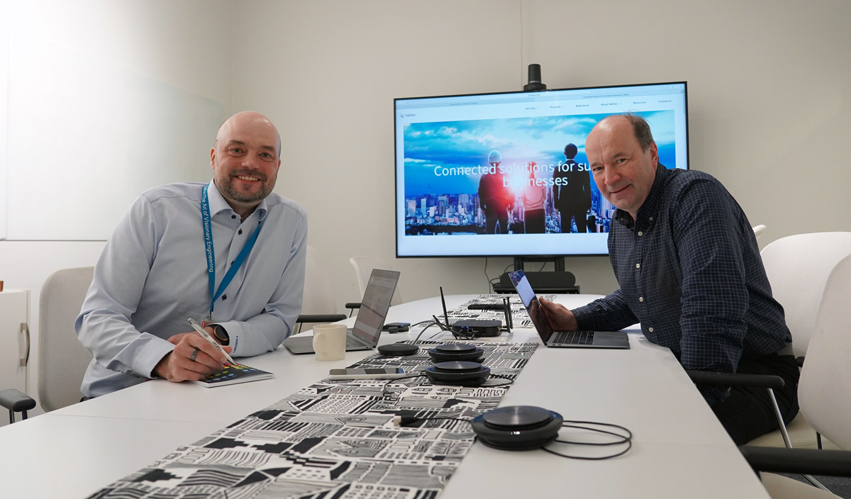 Haltian CEO Pasi Leipälä signs Embathic Building papers, joined by CTO Jyrki Okkonen