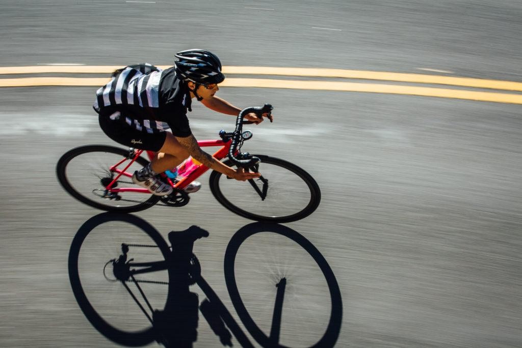 Man riding a bike with Omata GPS device