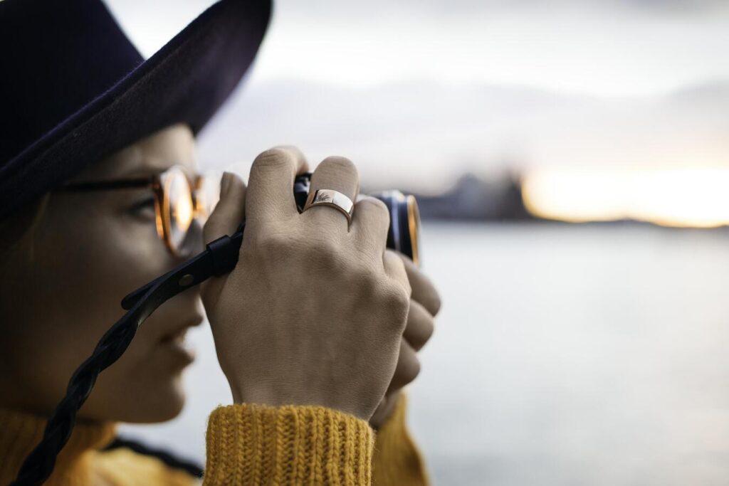 Girl photographing a sunset