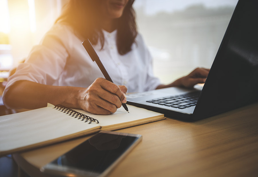 woman doing reserach on laptop for product creation