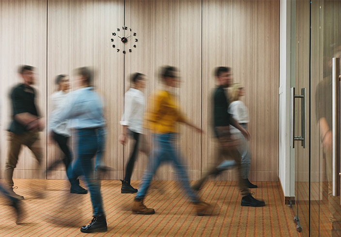 people flow through an office door