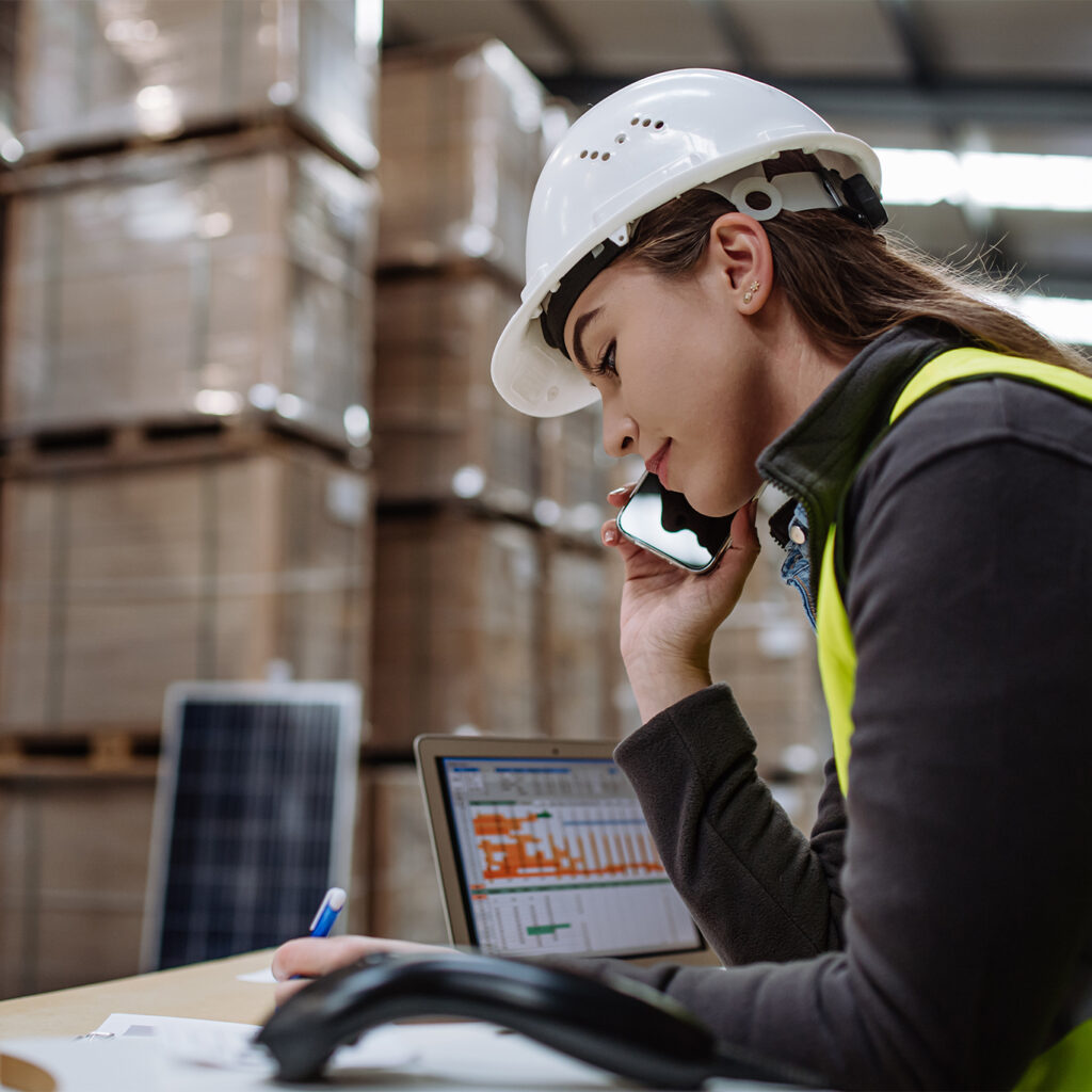 Woman on the phone getting real-time data on equipment tracking and asset inventory.