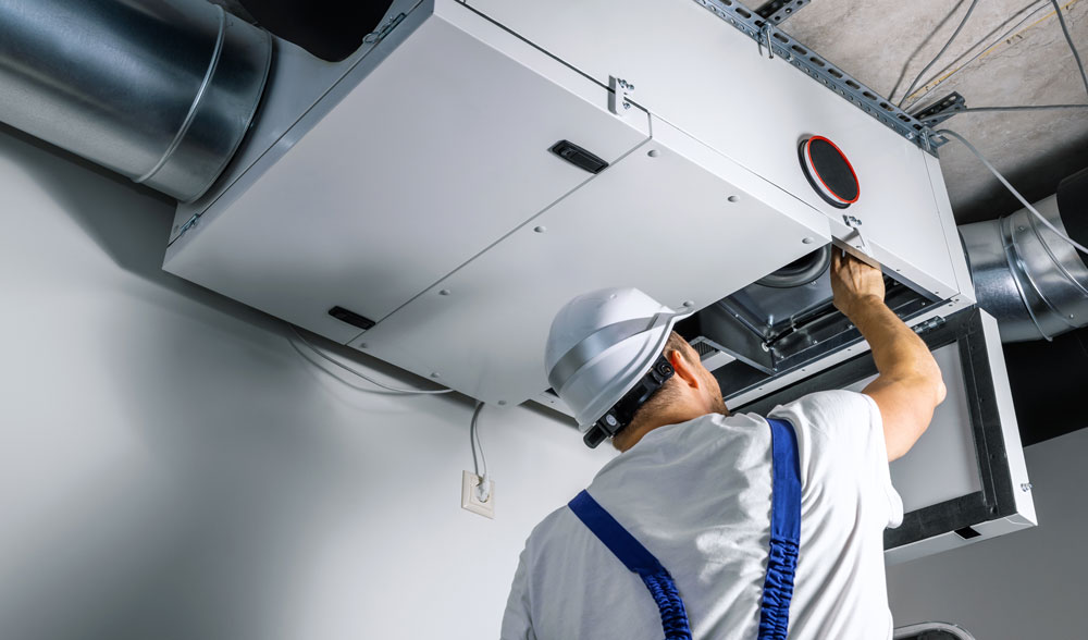 man working on HVAC system