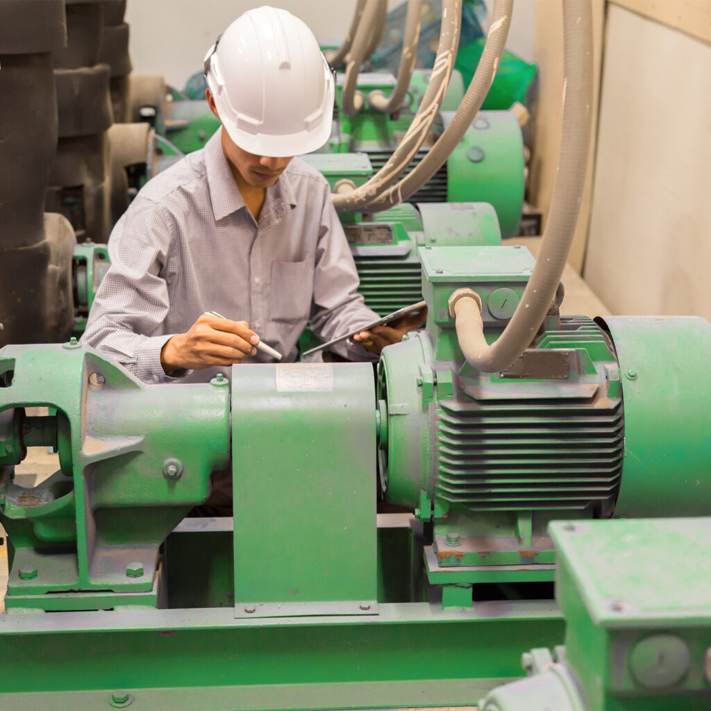 Man working with machine monitoring