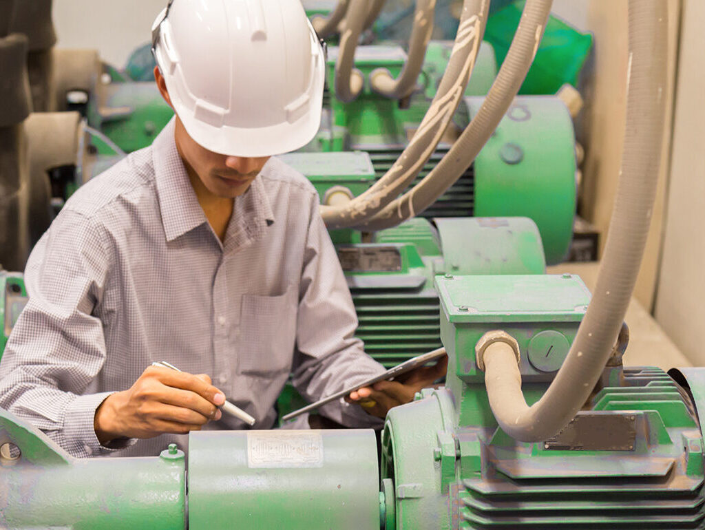 Man working with machine monitoring