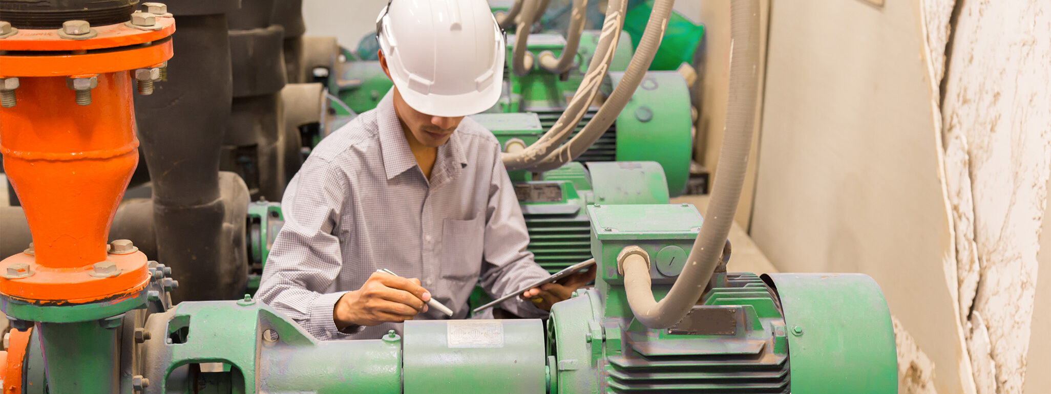 Man working with machine monitoring