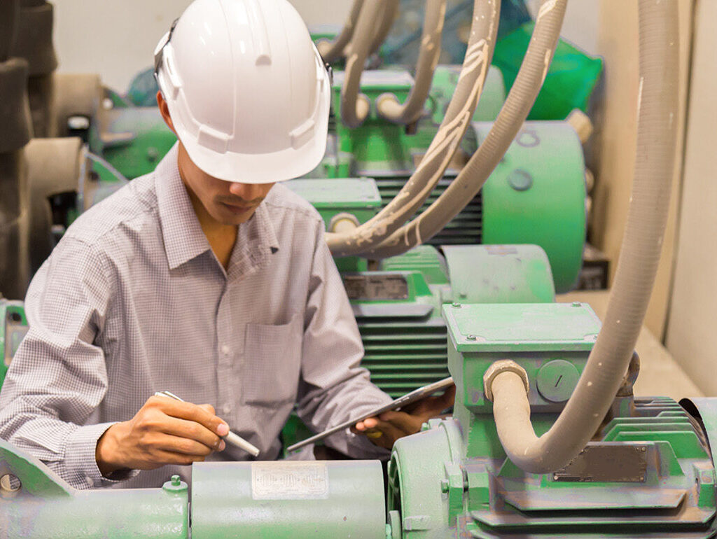 Man working with machine monitoring