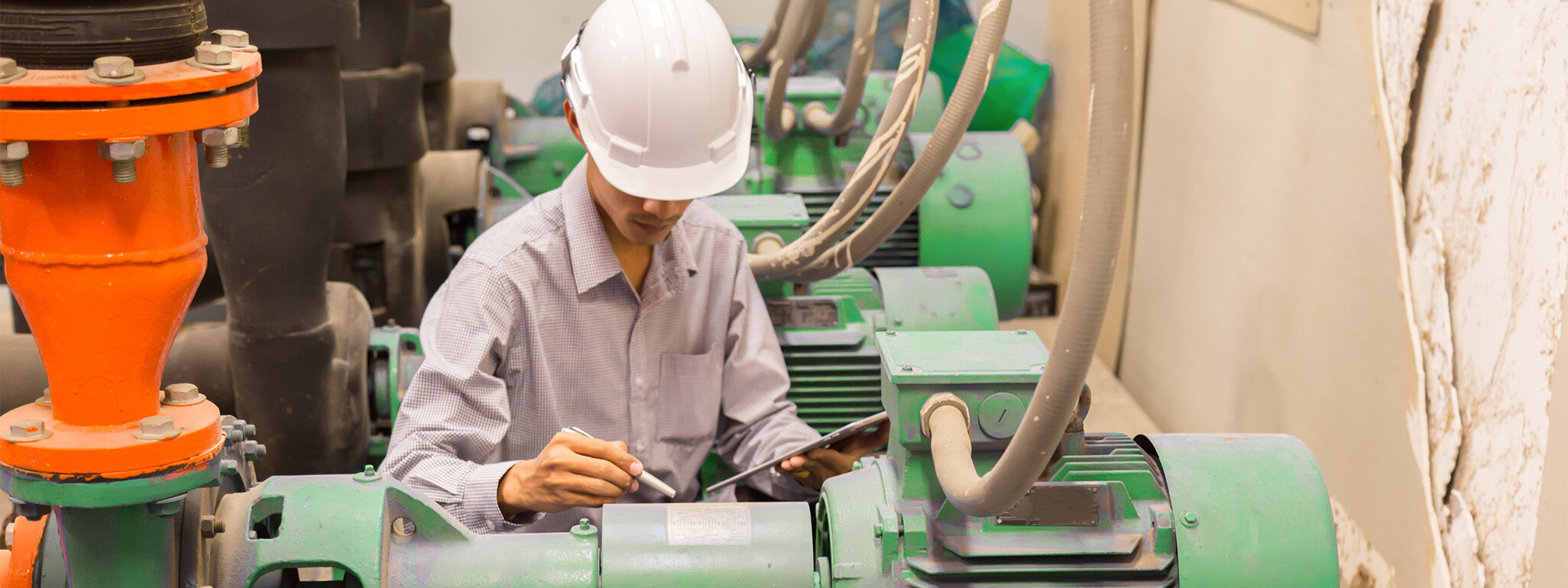 Man working with machine monitoring