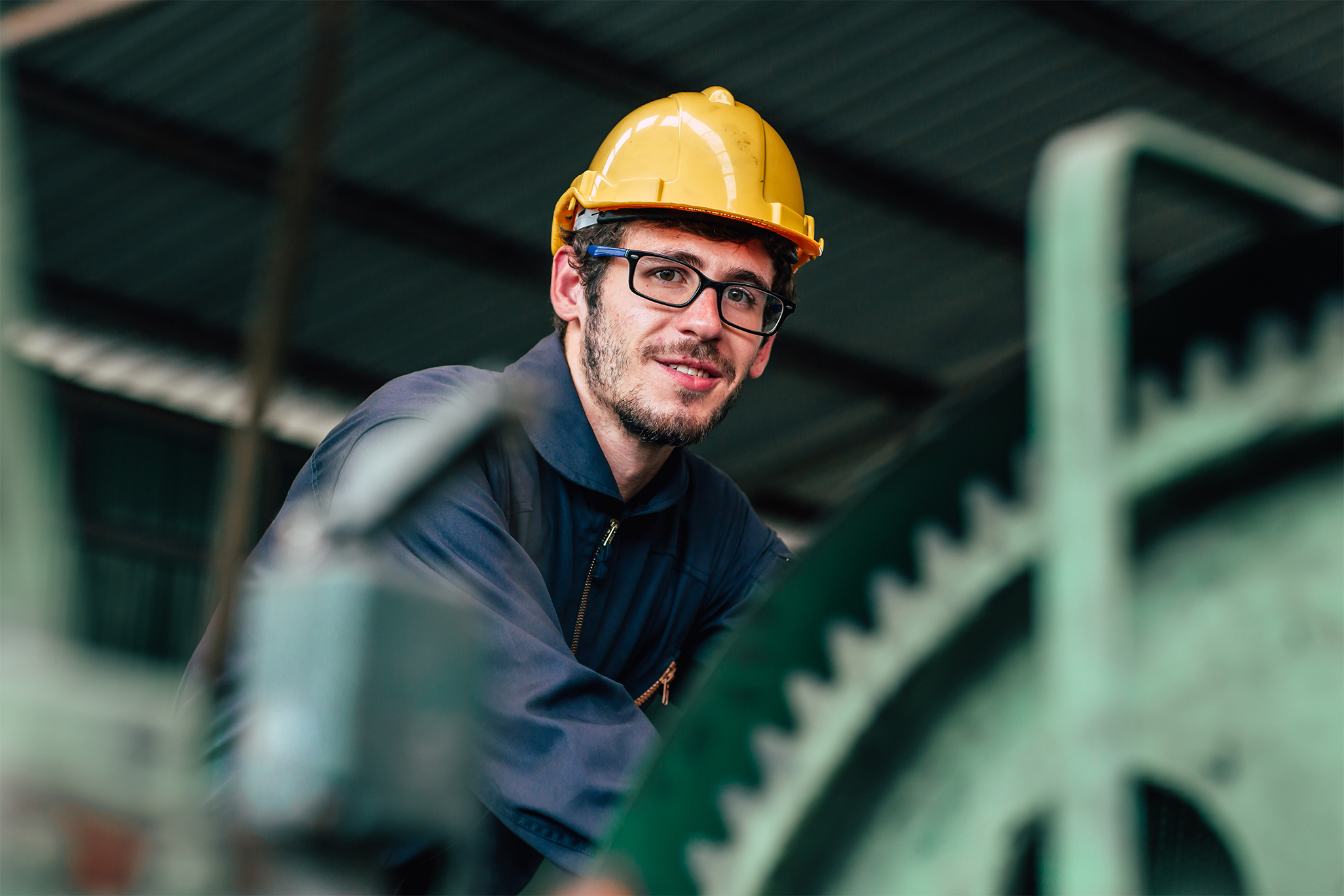 Person remote monitoring buildings with a hard hat on.